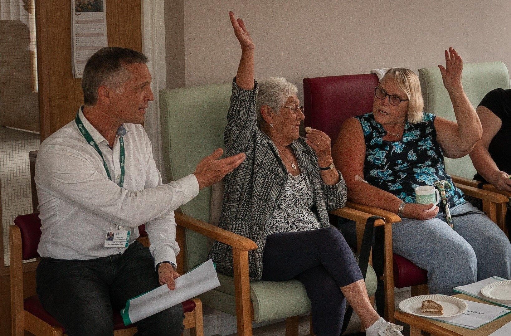 Residents taking part in a discussion with a housing representative.
